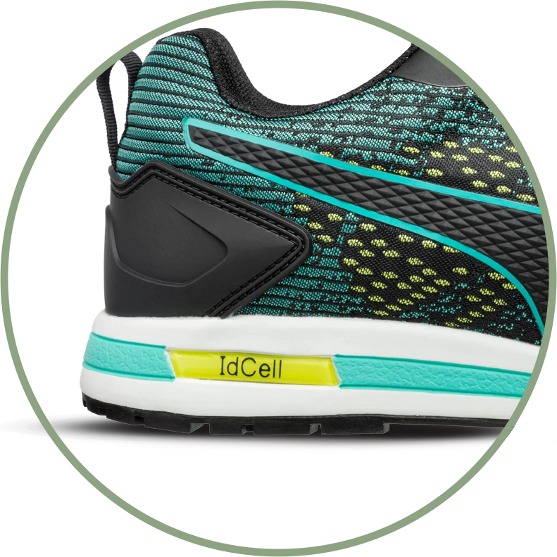 Detailansicht der Ferse des PUMA SAFETY VIVID LOW Sicherheitsschuhs S1P ESD in Schwarz mit türkis-gelben Akzenten und sichtbarer IdCell-Dämpfung.